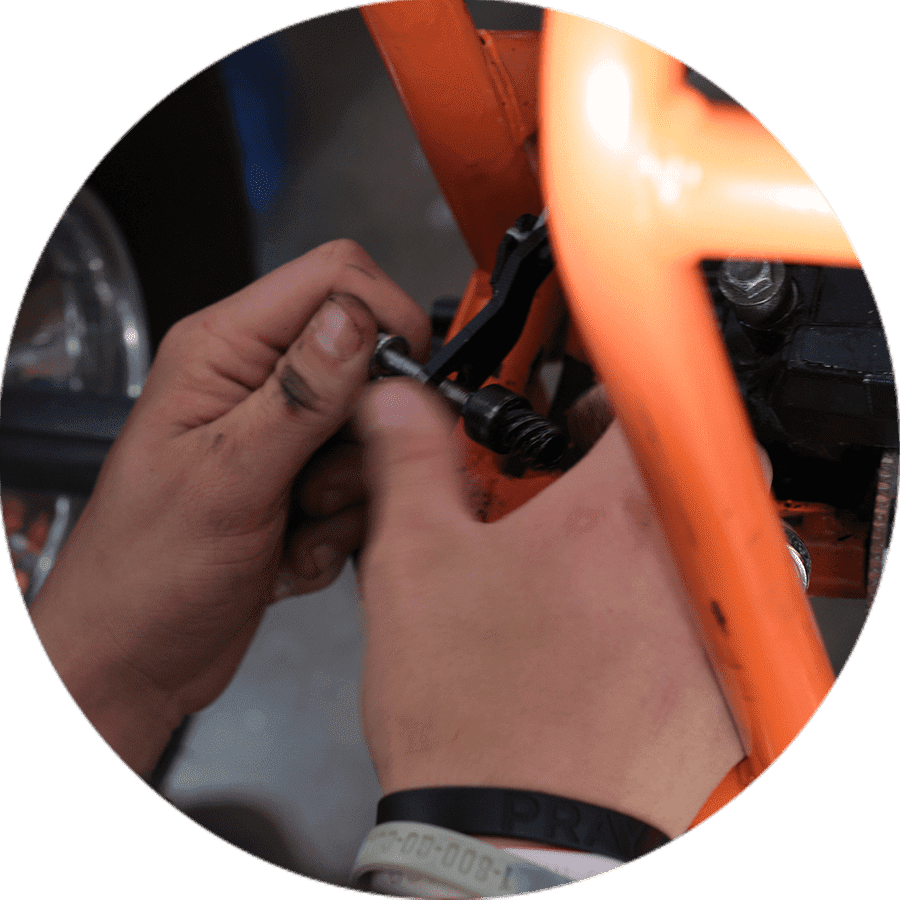 a student fastening a bolt