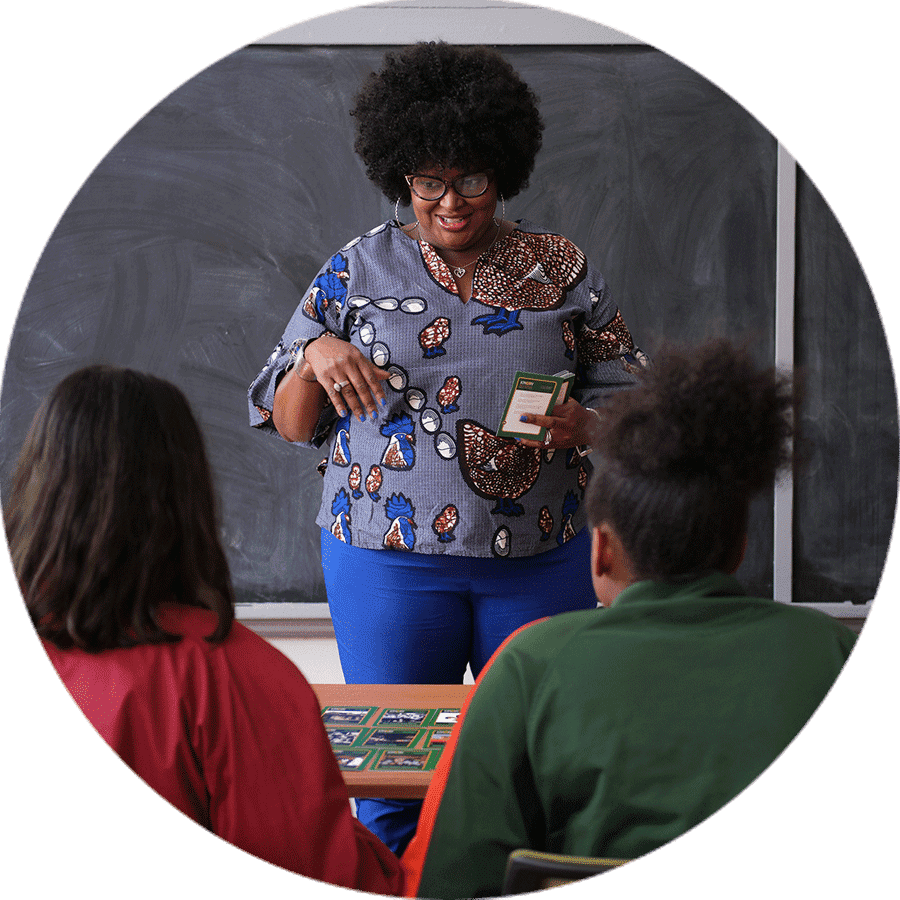 teacher at blackboard educating students