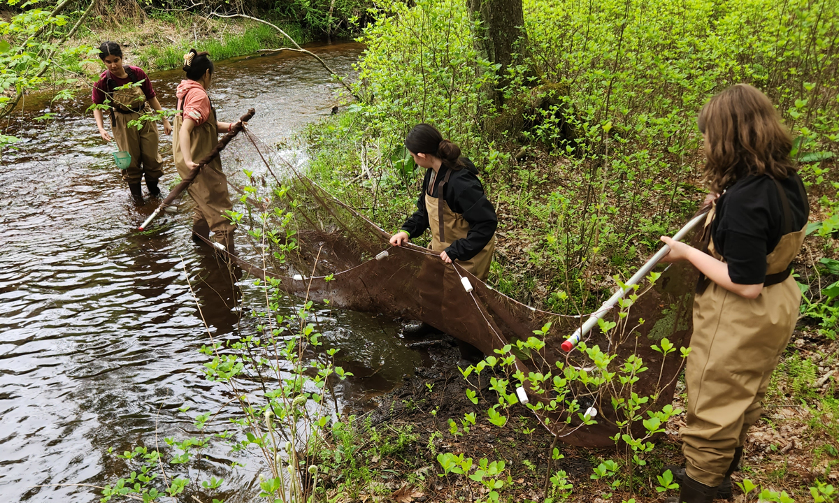 Students in West Cranston’s High School’s Aquaculture Pathway participate in a field experiment.